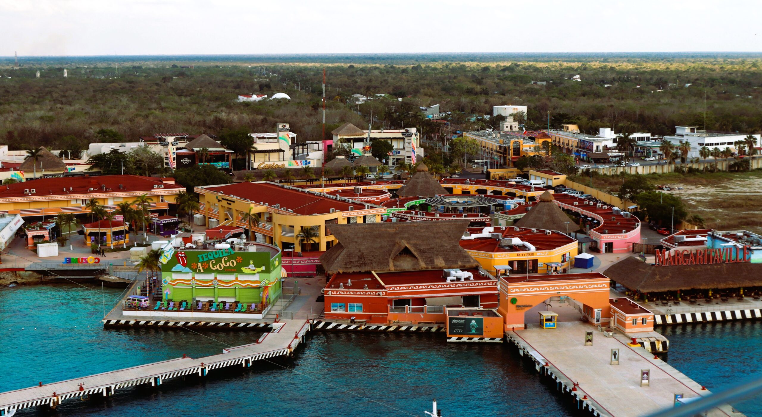 Cozumel International Cruise Port waterfront terminal with colorful buildings beside the Caribbean Sea